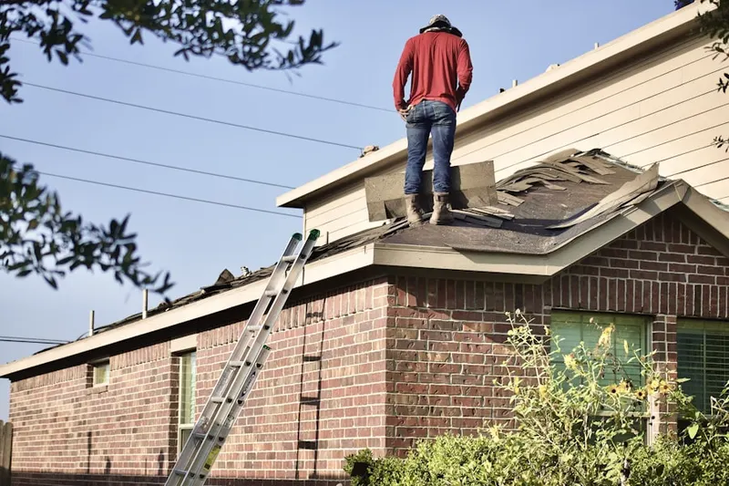 Professional roofer working on a residential roof in Downtown Pleasantville